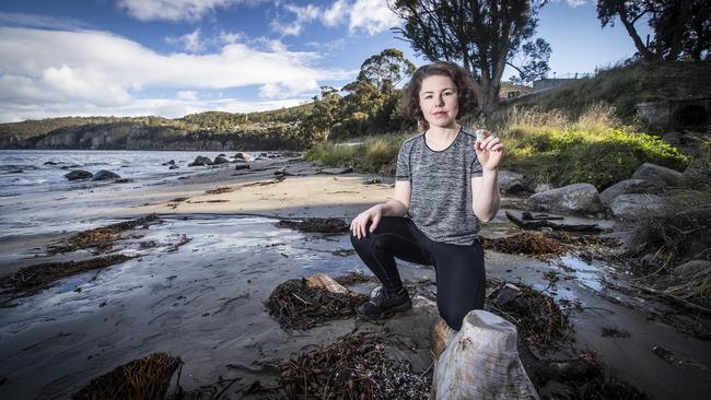 Heidi White at Taroona Beach where she discovered a lot of polystyrene balls have washed ashore. Picture: LUKE BOWDEN