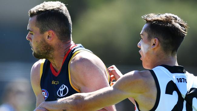 Brad Crouch of the Crows marks in front of Power draftee Connor Rozee in last weekend’s under 23 trial at Thebarton Oval. Picture: AAP/Mark Brake