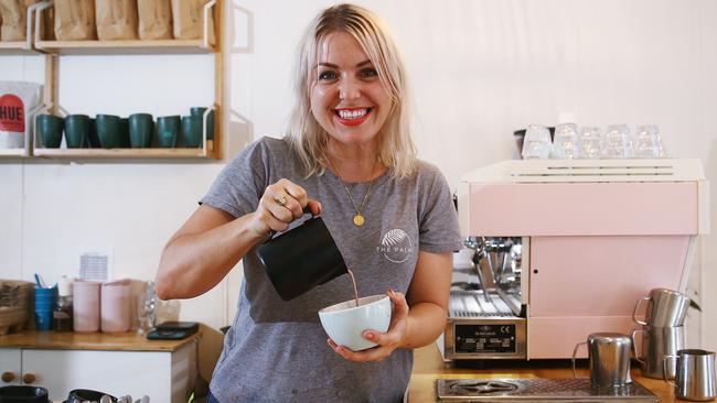 With the wet weather and cold temperatures Cairns is currently experiencing, coffee shops are finding themselves selling more mugs of hot chocolate than normal. Barista at The Palms cafe at Aeroglen Tiara Seccombe makes a hot chocolate for a customer. Picture: Brendan Radke