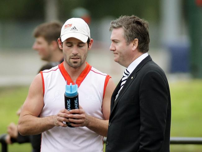 Collingwood president Eddie McGuire talking with Alan Didak about whether he was in the car.