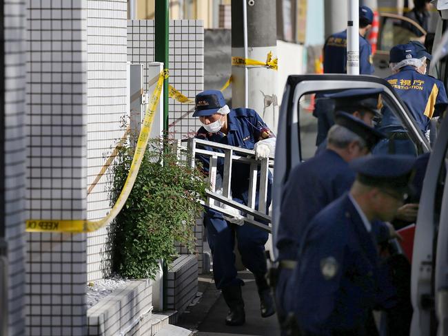 Police outside the serial killer’s apartment in suburban Zama in Tokyo, where he killed and cut up nine people. Picture: AFP.