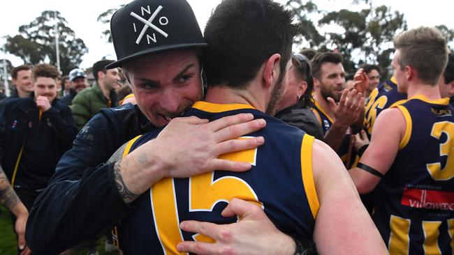 Rupertswood coach Nick Ash celebrates with Damon Cerini.