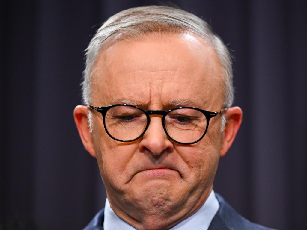 Anthony Albanese - surrounded by members of the First Nations Referendum Working Group - gets emotional as he speaks at a press conference. Picture: Lukas Coch/AAP
