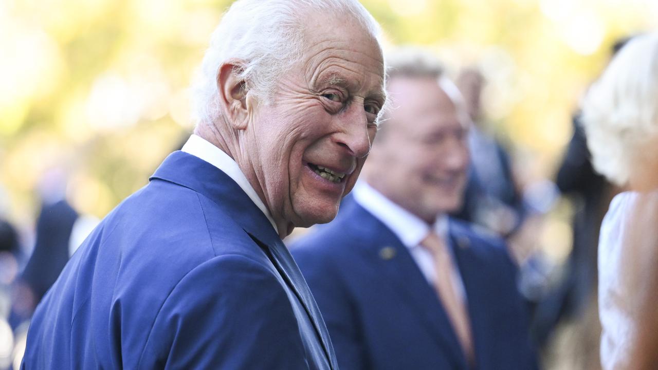 King Charles III flashes a cheeky smile as visits Canberra on Monday. Picture: NewsWire / Martin Ollman