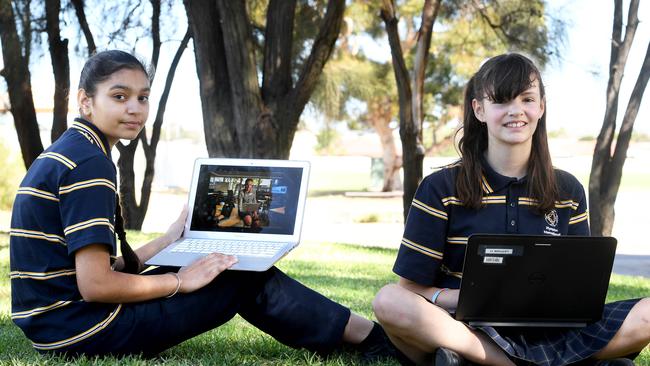 Plympton International High School students Anu Kaur, 13, and Hayley Rathjen, 12, are ready for the new world of online learning. Picture: Tricia Watkinson