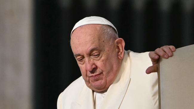 (FILES) Pope Francis arrives for the weekly general audience at St Peter's Square in The Vatican on November 13, 2024. Pope Francis's condition "continues to be critical", the Vatican said on February 22, 2025, explaining that he was alert and in his armchair but also required "high-flow oxygen" and blood transfusions. (Photo by Alberto PIZZOLI / AFP)