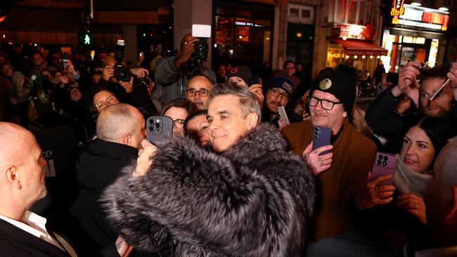 There were a LOT of Better Man premieres in Europe including this warm but chilly red carpet in Paris. Picture: Marc Piasecki/Getty Images.