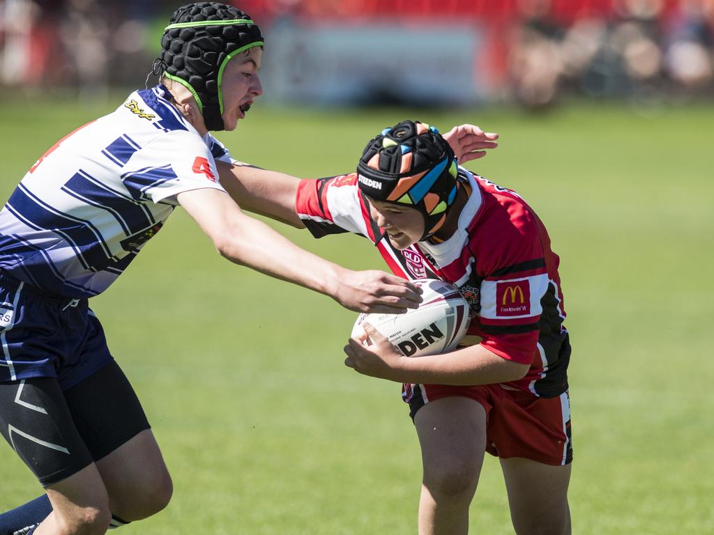 Caiden Bridger (left) of Brothers tackles Boston Norton of Valleys in under-13 boys Toowoomba Junior Rugby League grand final at Clive Berghofer Stadium, Saturday, September 11, 2021. Picture: Kevin Farmer