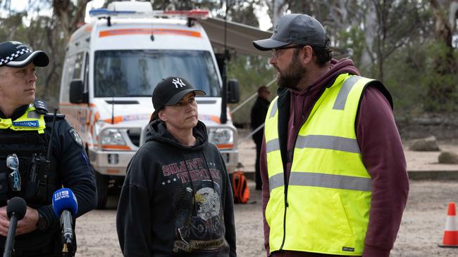 Inspector Matt Trask addresses the media with sister Melanie Blake and partner Steven Barrett. Picture: Brad Fleet