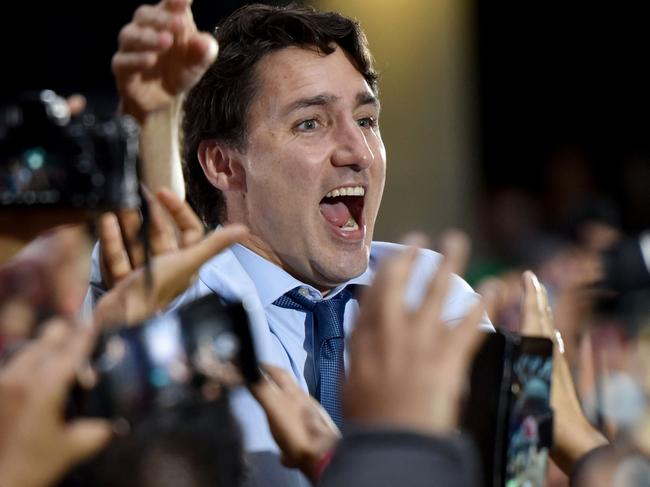 TOPSHOT - Leader of the Liberal Party of Canada, Prime Minister, Justin Trudeau, spoke to his supporters during a "Team Trudeau 2019" Rally at the Woodward’s Atrium in Vancouver B.C. on October 20, 2019. (Photo by Don MacKinnon / AFP)