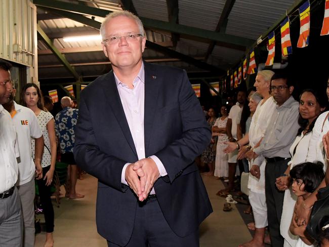  Scott Morrison greets people at the Leanyer Buddhist temple in Darwin, where he attended a  vigil for the victims of the Sri Lankan terrorist attacks. Picture: Keri Megelus