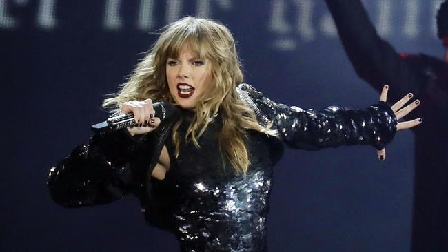 FILE - This May 8, 2018 file photo shows Taylor Swift performing during her "Reputation Stadium Tour" opener in Glendale, Ariz.  Eric Swarbrick, 26, of Austin, Texas, has been arrested on federal charges for sending threatening letters to Swift and showing up at her record label in Nashville, Tenn. Federal prosecutors in Nashville said in a press release Thursday, Sept. 20, that Swarbrick has been charged with interstate stalking and sending interstate communications with the intent to threaten. He is currently in custody in Texas and will be brought to Tennessee at a later date. (Photo by Rick Scuteri/Invision/AP, File)