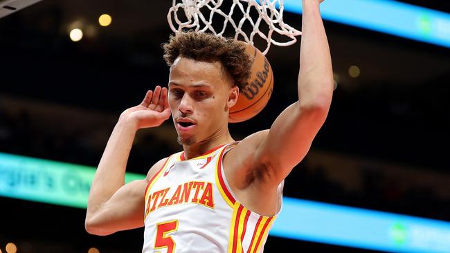 ATLANTA, GEORGIA - APRIL 01:  Dyson Daniels #5 of the Atlanta Hawks dunks against the Portland Trail Blazers during the first quarter at State Farm Arena on April 01, 2025 in Atlanta, Georgia.  NOTE TO USER: User expressly acknowledges and agrees that, by downloading and or using this photograph, User is consenting to the terms and conditions of the Getty Images License Agreement.  (Photo by Kevin C. Cox/Getty Images)
