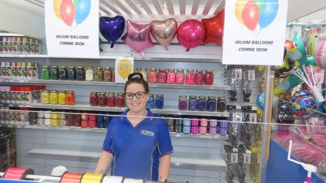 Choice staff member Haylee Macgregor at the store's balloon station, which will also stock helium balloons.