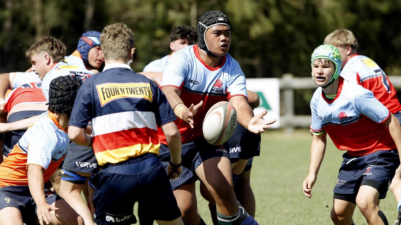 Illiyaz Villamu passes the ball in the match between Baxter (Red) and Gavin last year. Picture: John Appleyard