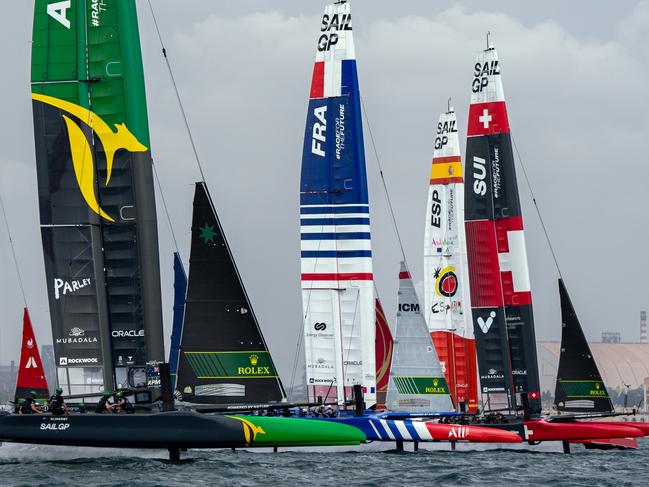 The SailGP fleet cross the start line at the start of Fleet Race One on Race Day 1 of the ROCKWOOL Italy Sail Grand Prix in Taranto, Italy. 23rd September 2023. Photo: Bob Martin for SailGP. Handout image supplied by SailGP