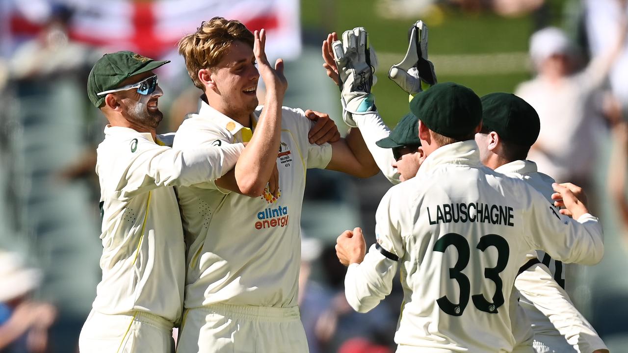 Green celebrates the wicket of Root with teammates in Adelaide. Picture: Quinn Rooney/Getty Images