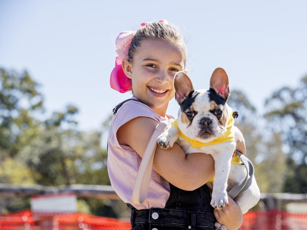 Sienna de Waal, 9, with Frankie at Paws at the Park held at Mudgeeraba showground on Sunday. Picture: Jerad Williams