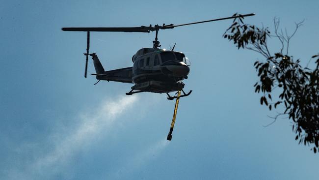 WA’s Department of Fire and Emergency Services issued a hazmat warning after a water-bombing helicopter accidentally drew water from a sewerage pond. Picture: Lachie Millard