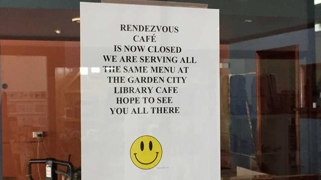 A sign announcing the closure of the Rendezvous Cafe. 