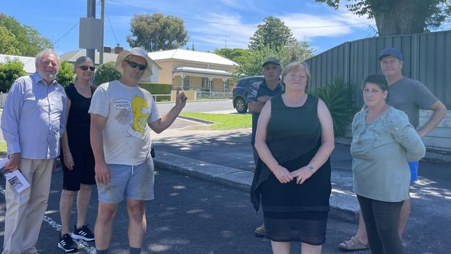 Violet St, Bendigo residents standing in the carpark of the old Pizza Hut where a new Guzman y Gomez drive trough would be located next to their homes. Picture: Gianni Francis.