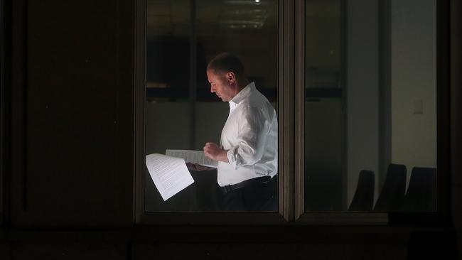 Josh Frydenberg works late into the night on the 2019 federal budget at the Treasury building in Canberra at the weekend. Picture: Kym Smith