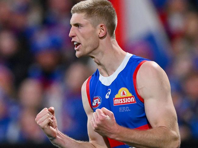 GEELONG, AUSTRALIA - AUGUST 26: Tim English of the Bulldogs celebrates a goal during the round 24 AFL match between Geelong Cats and Western Bulldogs at GMHBA Stadium, on August 26, 2023, in Geelong, Australia. (Photo by Morgan Hancock/Getty Images)