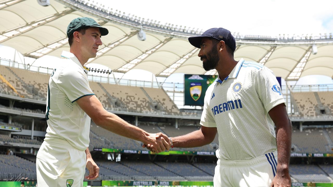 PERTH, AUSTRALIA - NOVEMBER 21: Pat Cummins of Australia and Jasprit Bumrah of India shake hands during a media opportunity ahead of the series First Test Match between Australia and India at Optus Stadium on November 21, 2024 in Perth, Australia. (Photo by Paul Kane/Getty Images)