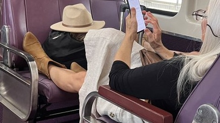 Two people have reportedly refused to give up their seat on a NSW train, instead putting their feet up. Source: X