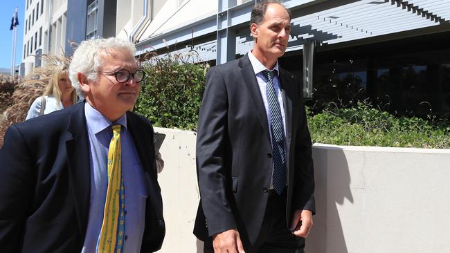 Christian Wenzel leaves Southport Court with defence lawyer Bill Potts. Picture: Adam Head