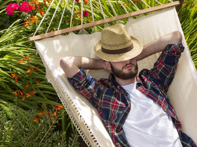 Young man having a snooze on a hammock.