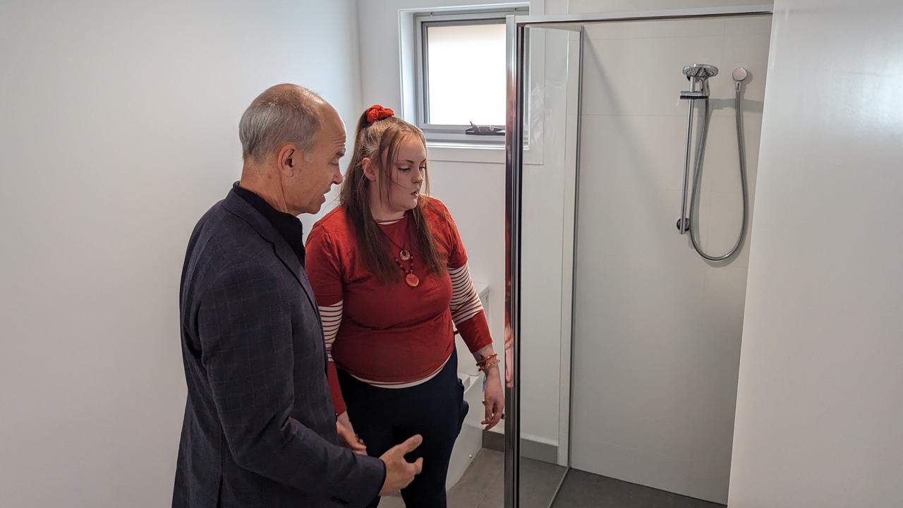 Housing Minister Guy Barnett inspecting a two-bedroom social house at Newstead with the inaugural resident, who lives with a disability. Picture: Alex Treacy