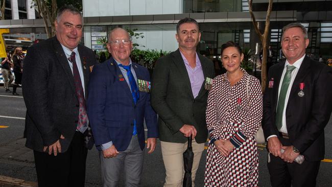 Thousands of people have braved the rain to gather in Brisbane for Anzac Day services. Picture: Grace Kessels