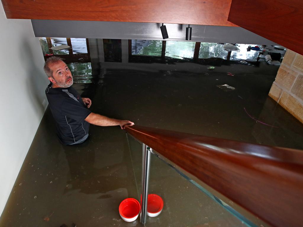 Dan Devine inspects his flood damaged home in Windsor in 2021. Picture: Toby Zerna