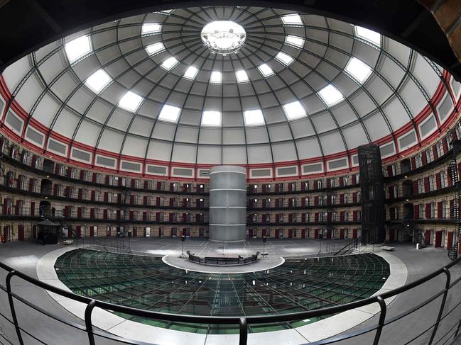 This photo taken on June 9, 2017 shows the inside of Boschpoort Prison, a dome-shaped prison in Breda, which is being transformed into offices and an entertainment venue following a drop in incarcerations in Dutch prisons for the past 20 years. The voices echo under the majestic and luminous dome of the prison of Breda, in the south of the Netherlands. They break the silence in this 130-year-old building, empty of all detainees like dozens of other penitentiary establishments in the country, and now utilized for a completely different use. / AFP PHOTO / EMMANUEL DUNAND