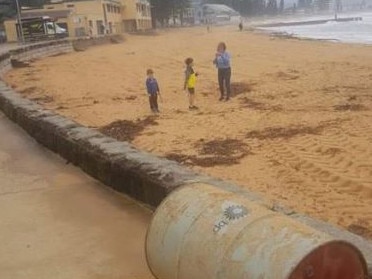 A floating oil barrel, with a BP motif, was found floating just off Collaroy beach. Two people managed to wrestle it on to the beach. Picture: Northern Beaches Clean Up Crew