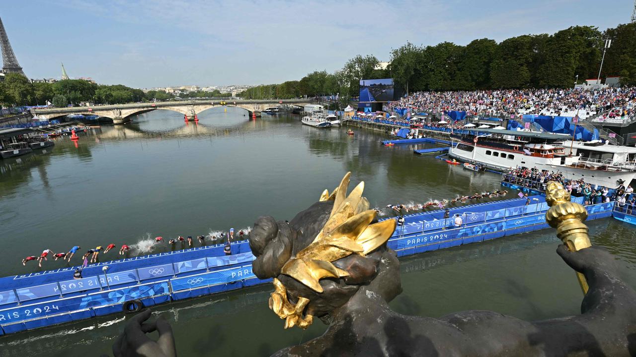 The start of the Paris men’s triathlon at the Pont de Alexander III bridge on the River Seine. Picture: AFP