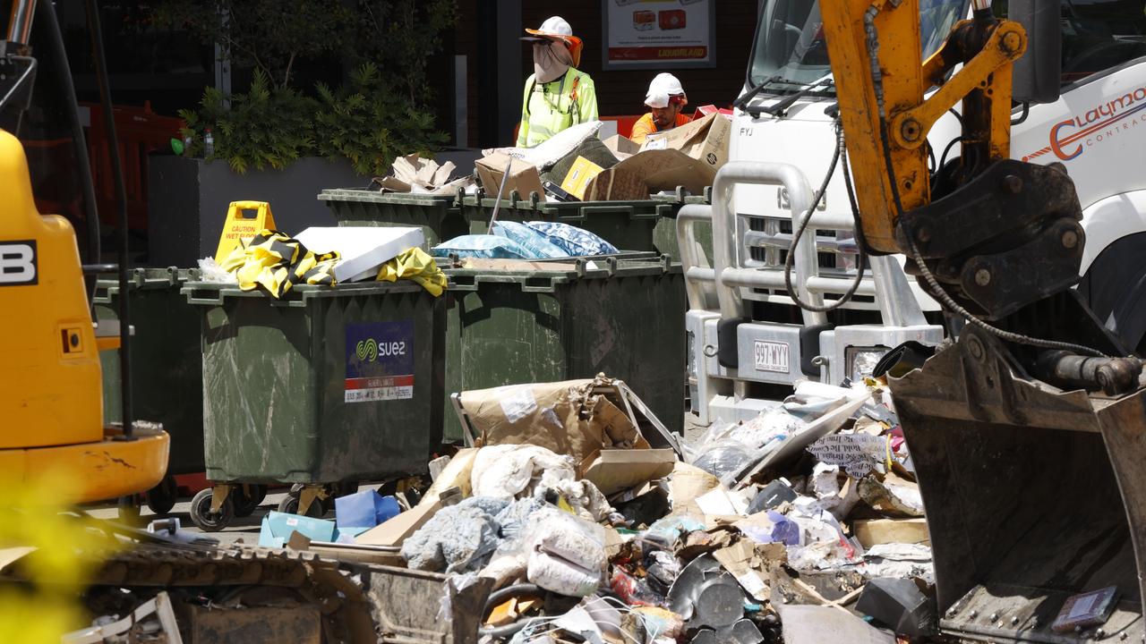 The clean-up at flood ravaged Toombul Shopping Centre which will close permanently.