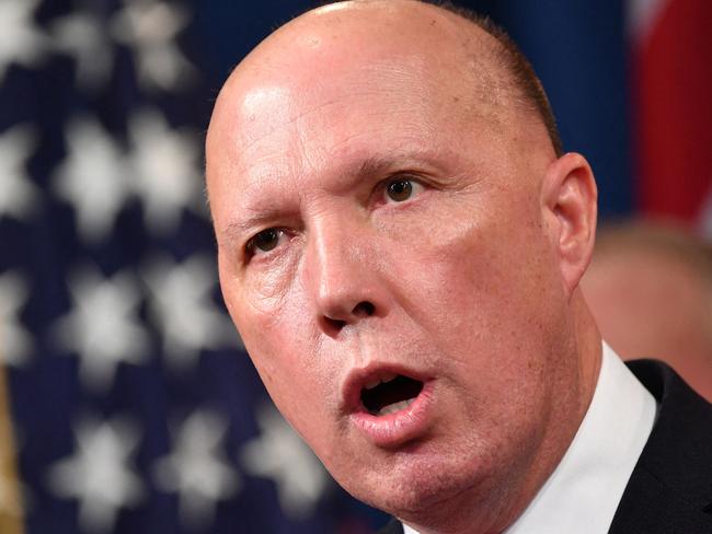 (FILES) A file photo taken on March 5, 2020 shows Australia's then-Home Affairs Minister Peter Dutton during a press conference at the Department of Justice in Washington, DC. - Dutton, who became Australia's new defence minister on March 29, 2021, is a hardline ex-cop who has overseen a controversial refugee policy, riled close ally New Zealand by deporting criminal Kiwis and publicly clashed with the Chinese government. (Photo by Mandel NGAN / AFP)