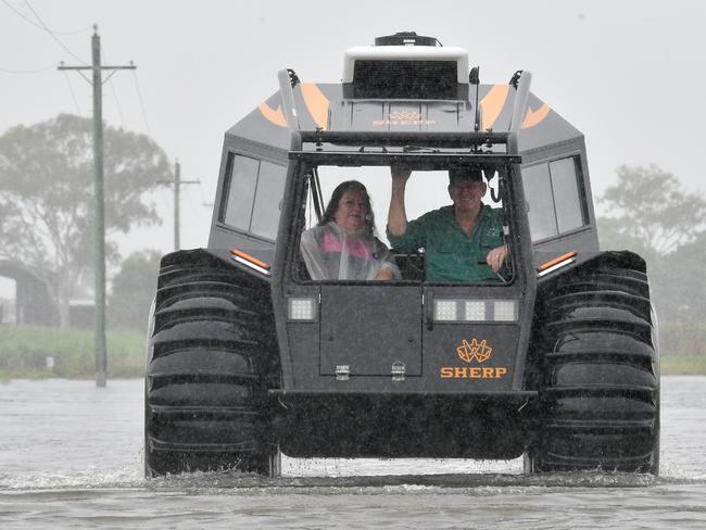 Tuesday February 12.. Heavy rain causes flooding in North Queensland. Groper Creek, near Home Hill cut off by flooding. Peter Collings with his SHERP has being doing grocery, medical and beer runs for Groper Creek residents. Groper Creek Caravan Park manager Jeanette Garvey with Peter.   Picture: Evan Morgan