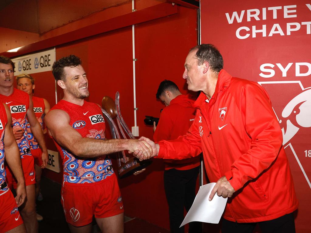 Luke Parker enjoys a Swans win with John Longmire.