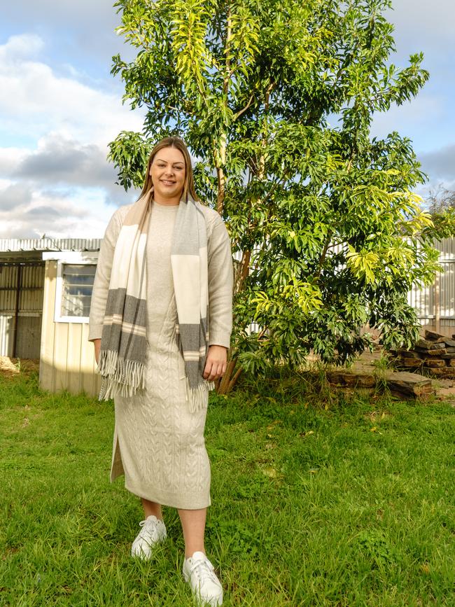 <b>MEMORIAL TREE:</b> Gemma Dalzotto in front of the tree her parents planted in memory of her sister who died before she was born. Picture: Nick Clayton.