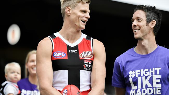 Nick Riewoldt and Western Bulldogs captain Robert Murphy launch Maddie’s Match with Nick’s wife Catherine and son James. Picture: Jason Edwards