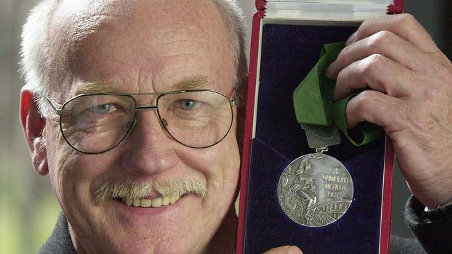 Australian sprinter Peter Norman with the silver medal he won for the 200m at the 1968 Mexico Olympics.