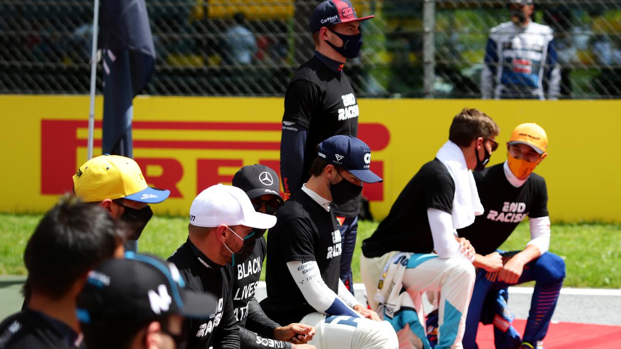 Max Verstappen stood again during the kneeling protest.