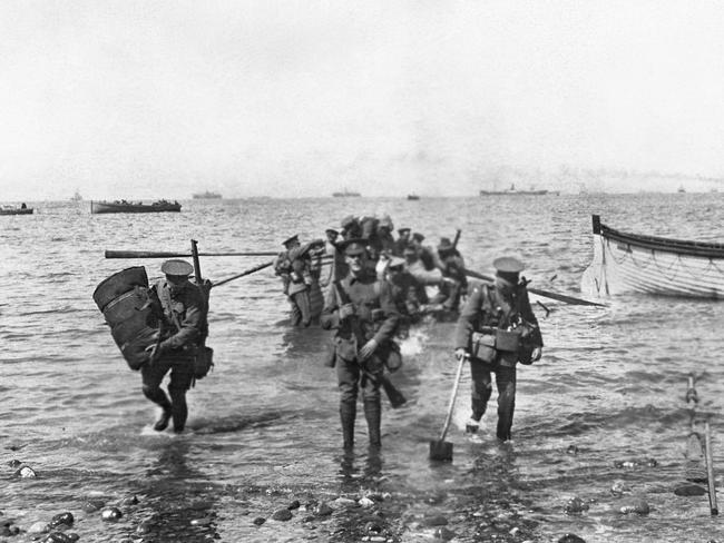 Divisional headquarters staff wade ashore at Anzac Cove on April 25, 1915. PHOTOGRAPH BY CHARLES EDWIN WOODROW BEAN