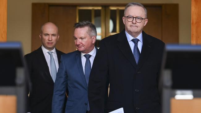 Matt Kean (l to r), Chris Bowen and Anthony Albanese head to a press conference to announce Ken’s new role. Picture: Martin Ollman