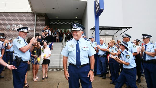 Superintendent Dave Swilks leaves Wyong Police Station amid a guard of honour after 44 years in the force. Picture: Peter Clark