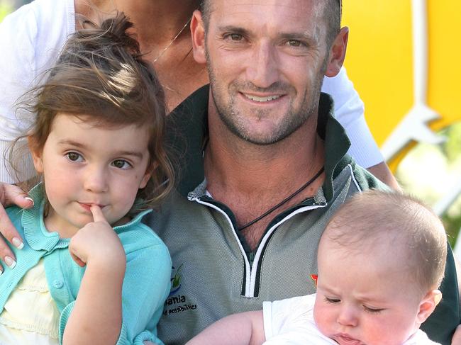 TLuca (right) as a baby when father Michael announced his retirement from cricket in 2008.