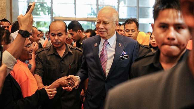 Malaysia's PM Najib Razak shakes hands with supporters in Kuala Lumpur.